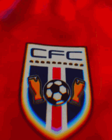 a close up of a cfc emblem on a red background