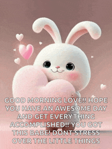 a picture of a bunny holding a heart with the words good morning love