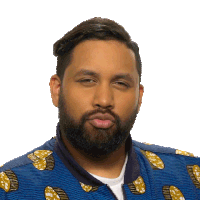 a man with a beard is wearing a blue jacket with a pattern of lemons on it