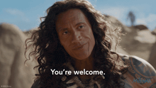 a picture of a man with long hair and the words you 're welcome on the bottom