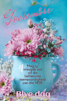 a bouquet of pink and blue flowers in a blue vase with the words goeiemore