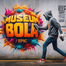 a man is spray painting a colorful sign that reads museum bola epic