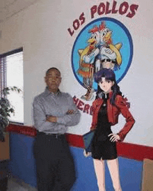 a man and a woman are standing in front of a los pollos restaurant .