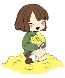 a girl is sitting on the ground holding a bouquet of yellow flowers .