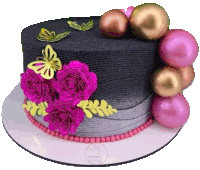 a black cake with pink roses and butterflies on top