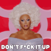 a drag queen says do n't f * ck it up in front of a pink background