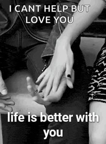 a man and a woman are holding hands in a black and white photo with a quote .