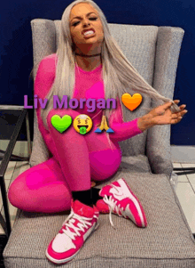 a woman in a pink outfit is sitting in a chair with the name liv morgan on the bottom