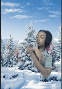 a person in a snowy forest with a blue sky