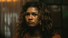 a close up of a woman with curly hair