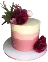 a pink and white cake with flowers and pearls on top