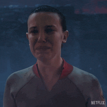 a close up of a woman 's face with netflix written on the bottom