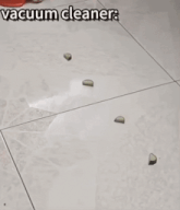 a vacuum cleaner is sitting on a tile floor