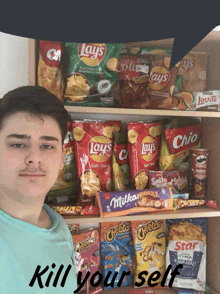 a man stands in front of a shelf full of lays chips and other snacks