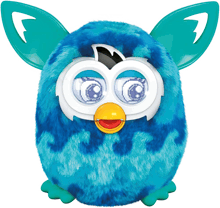 a blue furby toy with a yellow beak and blue eyes