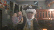 a man in a pirate costume points his finger