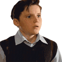 a young boy with a surprised look on his face is wearing a vest