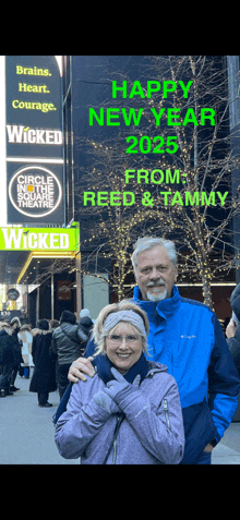 a man and woman standing in front of a sign that says happy new year from reed & tammy