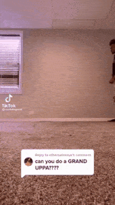 a tiktok video of a man jumping in the air with a reply to the comment can you do a grand uppa