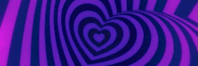 a heart shaped optical illusion on a purple and blue striped background .