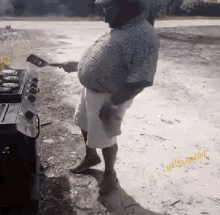 a man in a plaid shirt is cooking on a grill with a spatula and the words " yellow glow " on the bottom