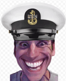 a man wearing a usn hat is smiling and making a funny face