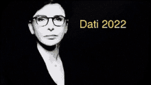 a black and white photo of a woman wearing glasses and the words data 2022