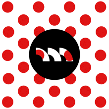 a black circle with red polka dots around it