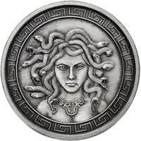 a silver coin with a woman with snakes on her head