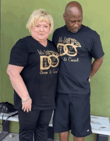 a man and a woman standing next to each other wearing black shirts that say we still do