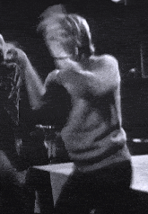 a black and white photo of a person 's back