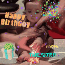 a happy birthday greeting card with a baby playing with confetti