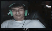 a man wearing green headphones with the name pepe on the bottom right