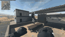 a screenshot of a video game shows a soldier jumping off of a building