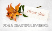 a thank you card next to a flower with the words for a beautiful evening