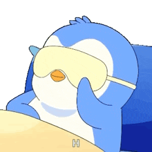 a blue and white penguin wearing a sleep mask with the letter h on the bottom