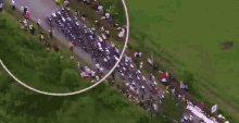 an aerial view of a group of people riding bicycles on a road with the word joy written on the ground