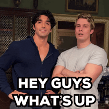 two men standing next to each other with the words " hey guys what 's up " on the bottom