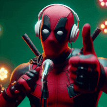 deadpool is wearing headphones and holding a microphone and giving a thumbs up