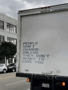 the back of a metro truck has a message on it