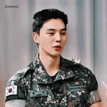 a man in a military uniform has a name tag that says bong