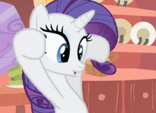 a white pony with a purple mane and a horn is giving a thumbs up