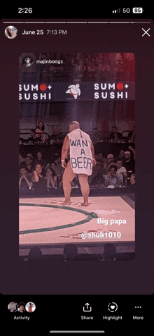 a picture of a sumo wrestler wearing a shirt that says " wan a beer "