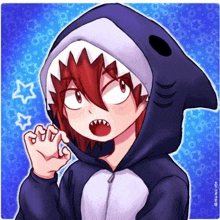 a boy is wearing a shark costume with a hood .