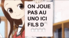 a cartoon girl is holding a sign that says on joue pas au uno ici fils d