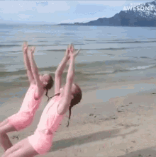 two girls are doing a handstand on the beach and the words awesome are on the bottom of the screen