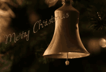 a bell hanging from a christmas tree with merry christmas written in the background