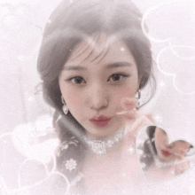 a girl with a necklace and earrings is surrounded by hearts and sparkles