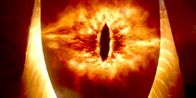 a close up of a burning eye with flames coming out of it .