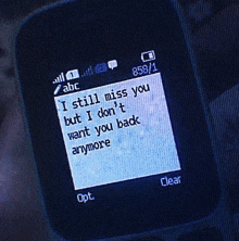 a cell phone with a message on it that says `` i still miss you but i don 't want you back anymore ''